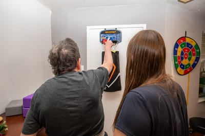 Residents engaging in a game activity indoors.