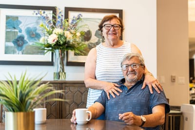 Couple enjoying time together in the facility's common area.