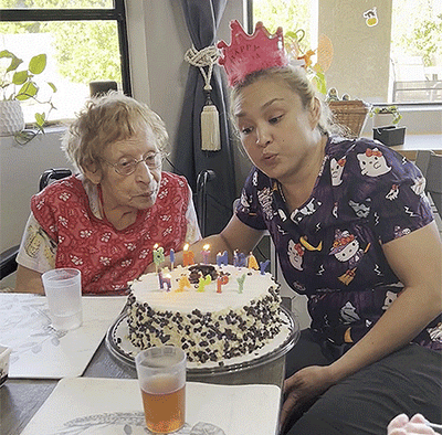 Residents celebrating a birthday with cake