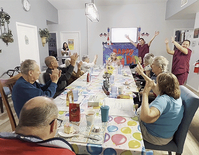 Residents celebrating with cake and decorations