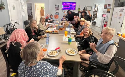 Residents enjoying a communal meal and activities.