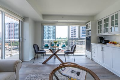 Bright, modern apartment interior with city view.