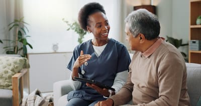 Nurse conversing with a resident in a common area