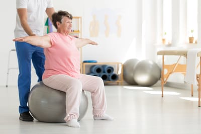 Senior woman exercising on a stability ball.