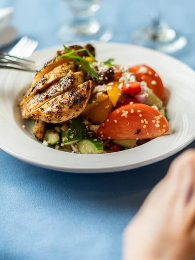 Grilled chicken salad on a dining table
