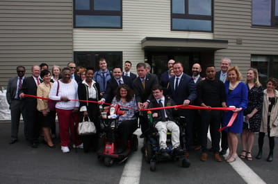 Ribbon-cutting ceremony with residents and staff