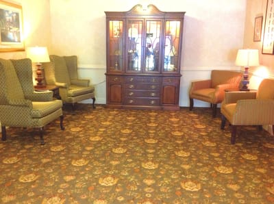 Common area with seating and display cabinet