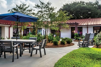 Outdoor seating area with garden and pathways