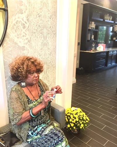 Resident enjoying a moment in the facility's interior.