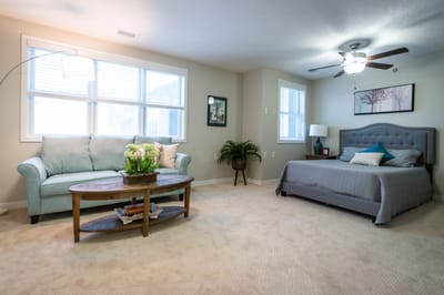 Cozy bedroom and sitting area in assisted living facility