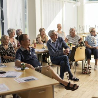 Residents engaged in an activity session indoors.
