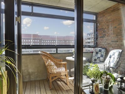 Cozy balcony with seating and plants