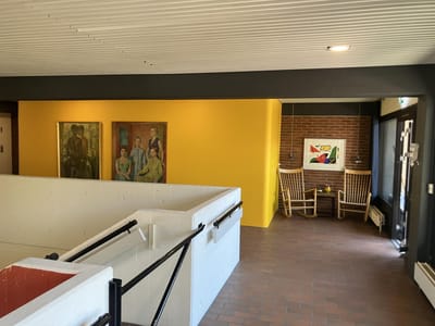 Interior hallway with art and seating