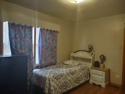 Cozy private room with a bed and decor