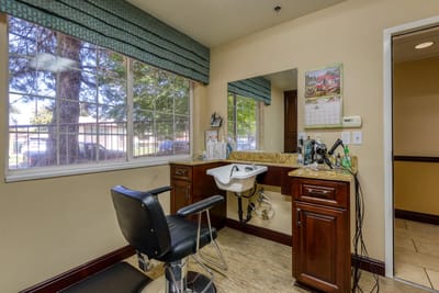 Beauty salon area with chair and mirror