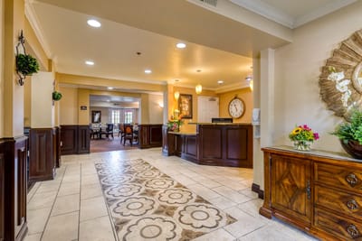 Bright and welcoming lobby area with flowers and seating