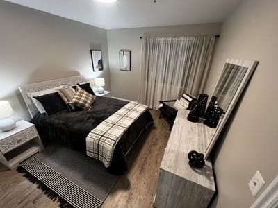 A well-decorated private resident room with modern furniture