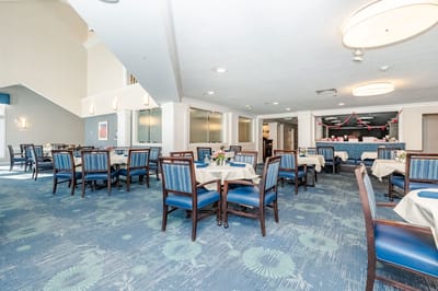 Bright dining room with tables and chairs