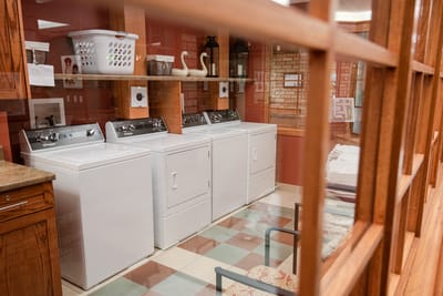 Fairview Nursing Home, nursing home — Laundry room with washing machines and baskets