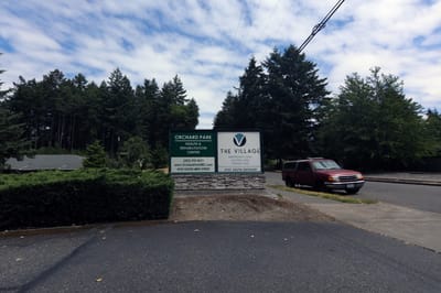 Sign for The Village Senior Living facility