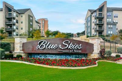 Exterior view of Blue Skies of Texas with landscaping