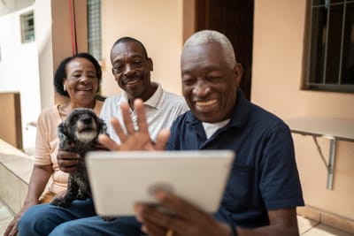 Residents enjoying time together with a tablet