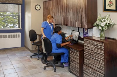 Staff assisting in a facility office environment