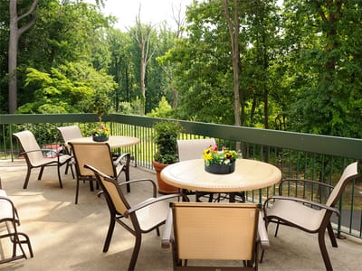 Outdoor patio area with seating and flowers