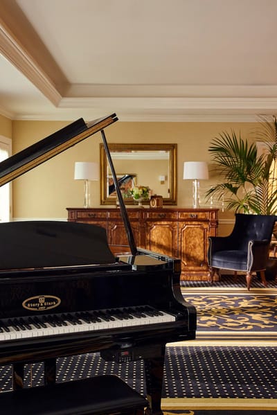 Interior view showcasing a grand piano and elegant decor
