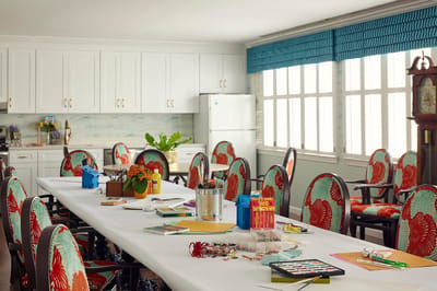 Interior activity room with creative supplies and seating