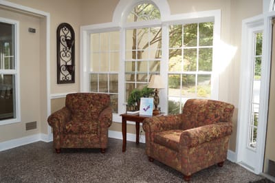 Cozy interior seating area with floral chairs
