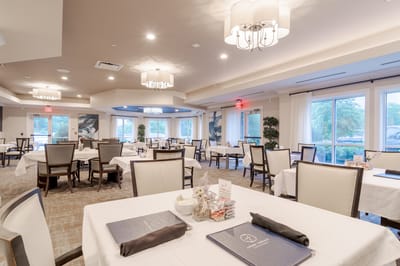 Dining room with tables set for residents