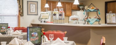 Dining area with table settings and decor