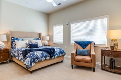 Cozy private room with bed and armchair