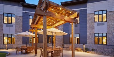 Outdoor seating area with pergola and lights
