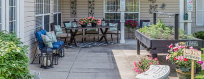 Outdoor patio area with seating and garden boxes