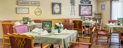 Dining area set with tables and flowers