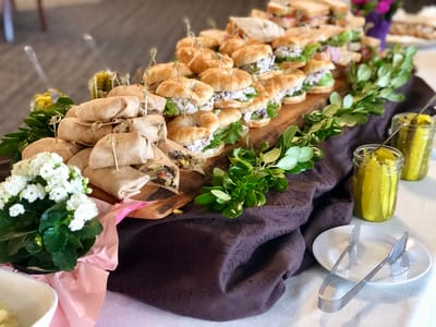 A beautifully arranged platter of sandwiches and wraps