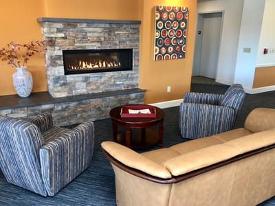 Common area with a fireplace and seating