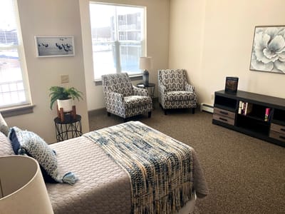 Stylish private resident room with comfortable furniture