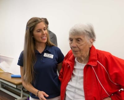 Care staff interacting with a resident