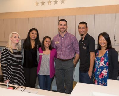 Staff members in a welcoming common area.