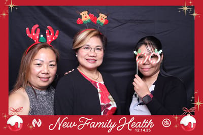Three women wearing festive accessories