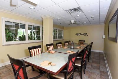 Dining area with tables and chairs.