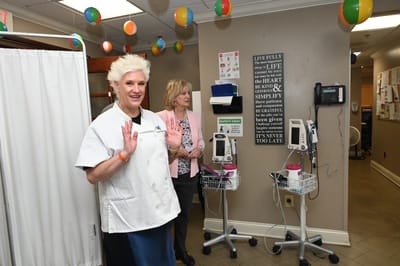 Staff members interacting in a welcoming facility space.
