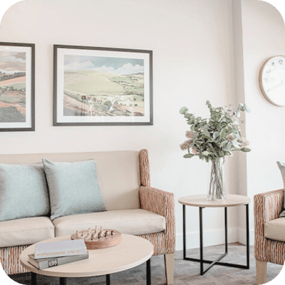 Comfortable lounge area with plants and artwork