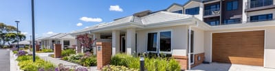 Exterior view of a well-maintained assisted living facility.
