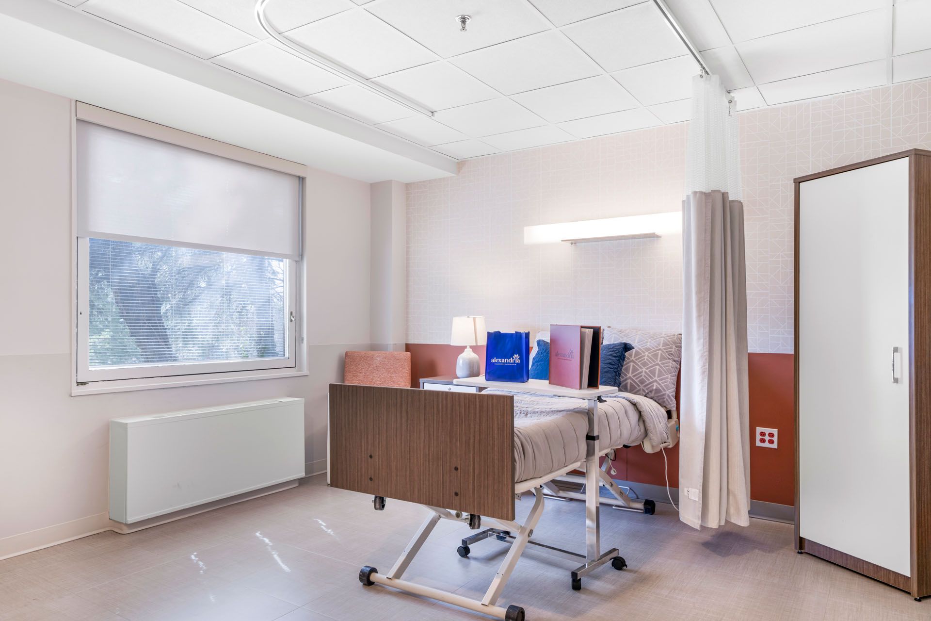 Private resident room with a hospital bed and decor