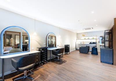 Beauty salon with styling chairs and mirrors