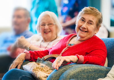 Residents smiling in a social setting